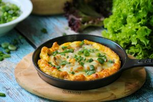 Golden, fluffy frittata filled with spinach, cheese, and vegetables.
