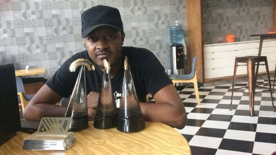 Shayzar, a multi-award-winning  music producer, proudly showcasing his accolades Picture: Supplied.
