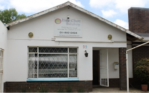 Front view of Boksburg Kidz Clinic, a child support centre with a white exterior and a welcoming open door.