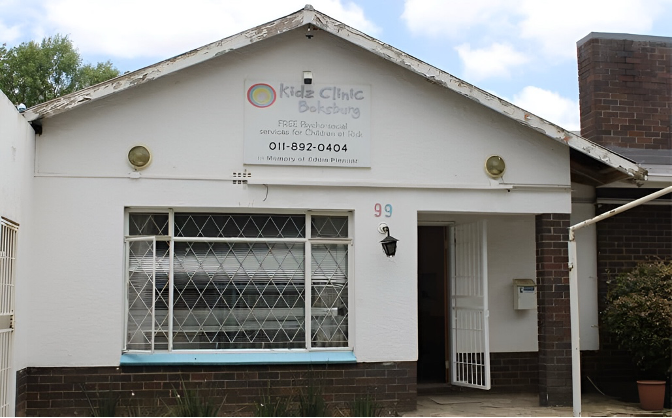 Front view of Boksburg Kidz Clinic, a child support centre with a white exterior and a welcoming open door.