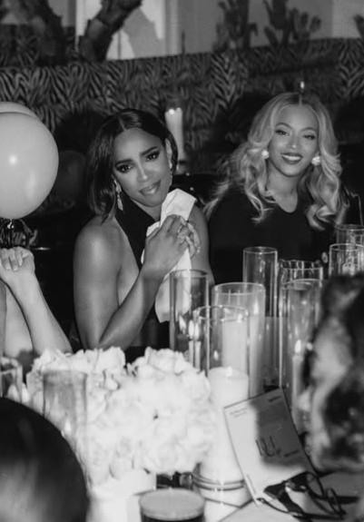 Kelly Rowland and Beyoncé Knowles sitting together at the table. Picture: Instagram@Beyoncé 