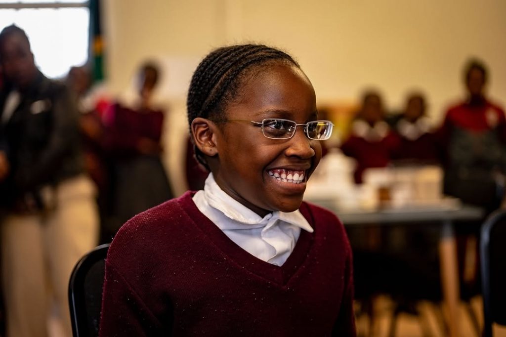 A joyful learner beams proudly wearing her brand-new glasses. Picture: Instagram@RachelKolisi