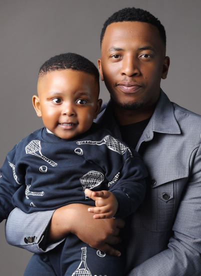 Dumi Mkokstad lovingly holds his son Neyame in his arms. Picture: Instagram@DrZiphozenkosi