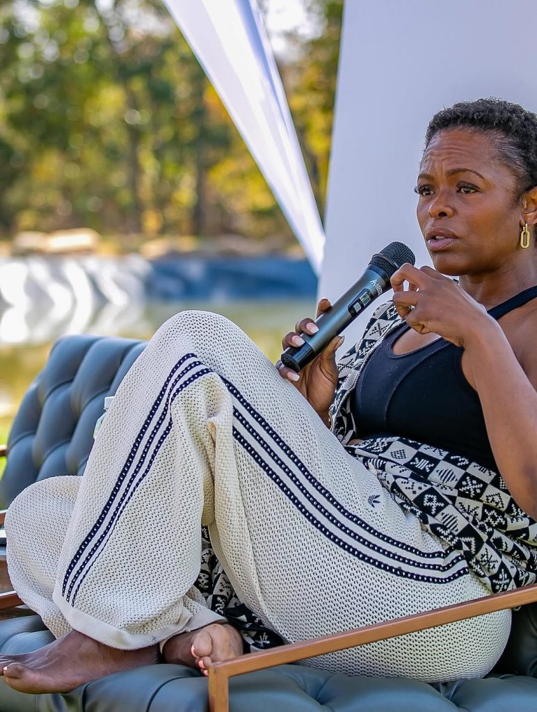 Unathi holding the mic and keeping it real as she connects with the women at the retreat. Picture: Instagram@UnathiAfrica
