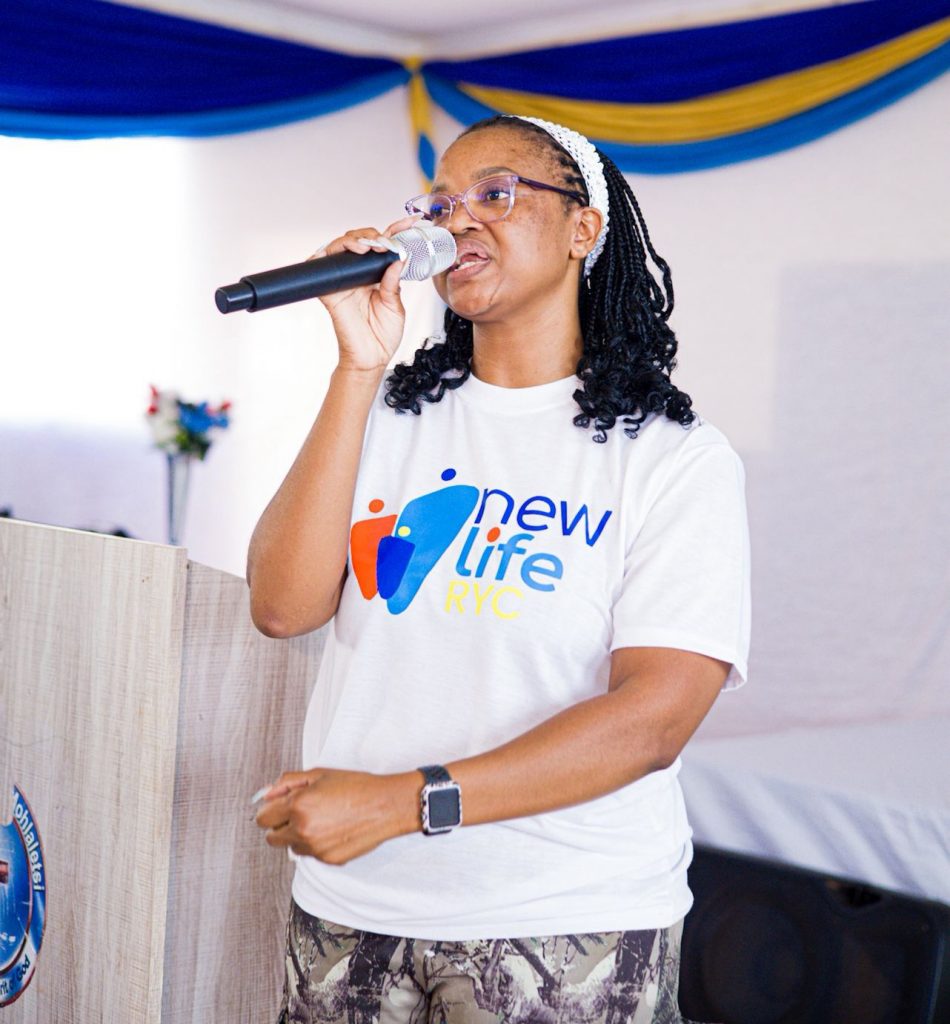 The brave speaker Moshiane standing on stage, holding a microphone as she addresses the crowd. Picture: Supplied