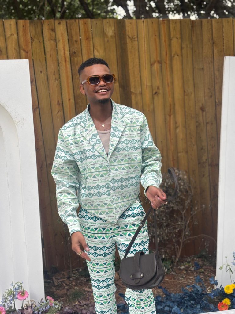 Hello, Spring vibes! Lesedi Baakwalanya beams with joy, confidently rocking a standout piece from their fresh spring menswear collection. Picture: Supplied