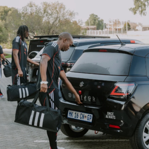 Orlando Pirates players with their branded Suzuki car