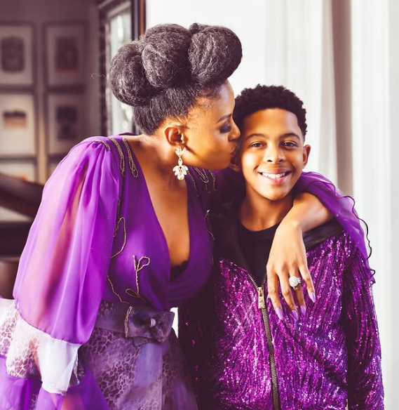 Sealed with a kiss: Bassie planting a sweet kiss on her son uShaka Kgosi's cheek. Picture: Instagram@BasetsanaKumalo