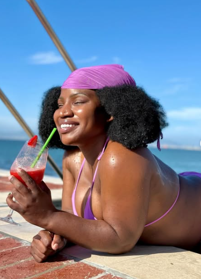 With a smile and a drink in hand, Makhadzi relaxes in the pool, gearing up as the countdown to her new album begins. Picture: Instagram@Makhadzisa