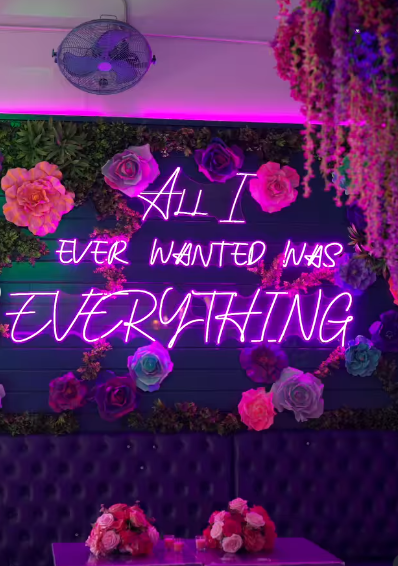 A stunning view of the venue, glowing with colourful lights and adorned with vibrant flowers. Picture: Instagram@Monicadenise