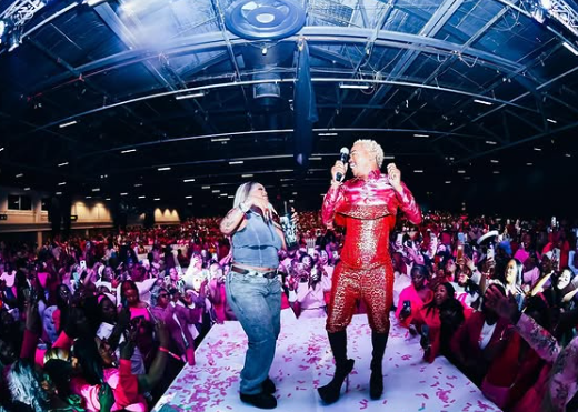 On stage and in rhythm, Somizi shared a dance moment with one of the artists. Picture: Instagram@SomiziMhlongo