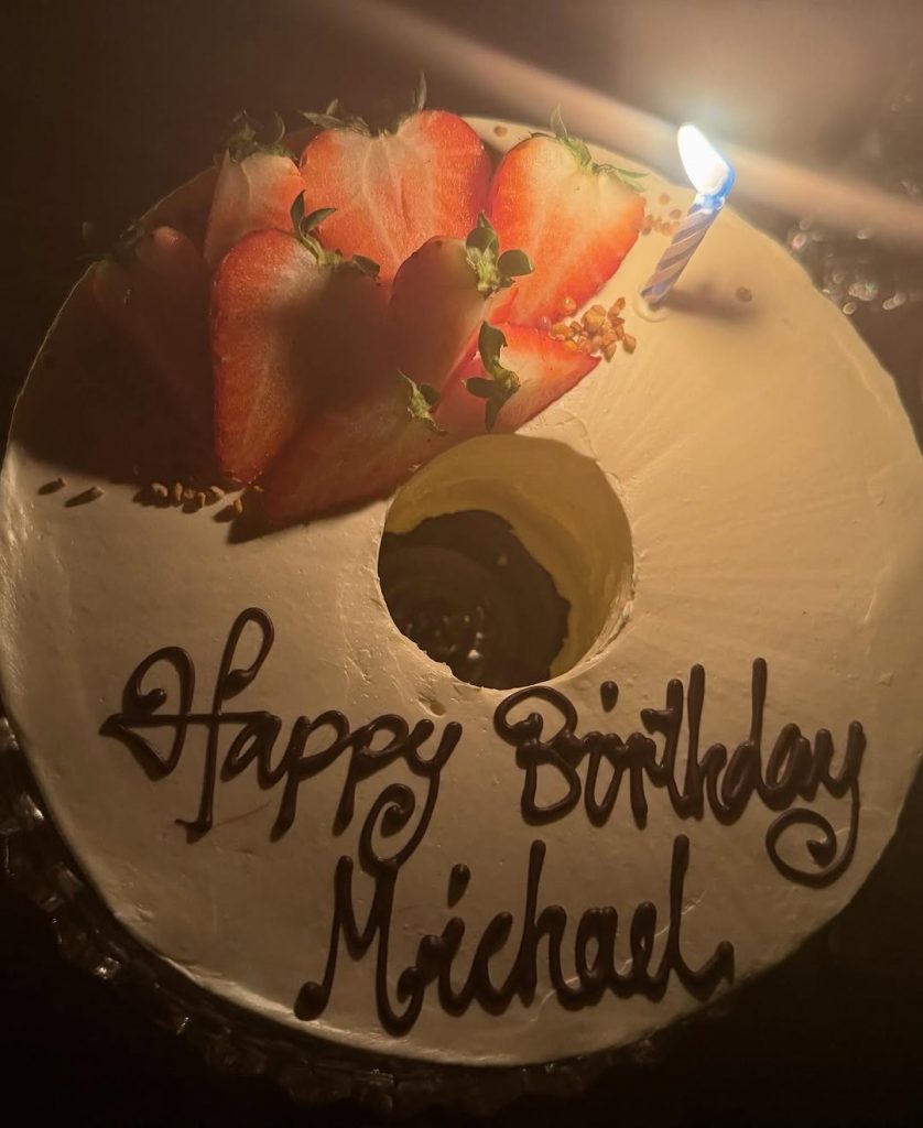 A stunning birthday cake for Michael Polansky, topped with fresh strawberries and swirls of rich chocolate cream. Picture: Instagram@Ladygaga