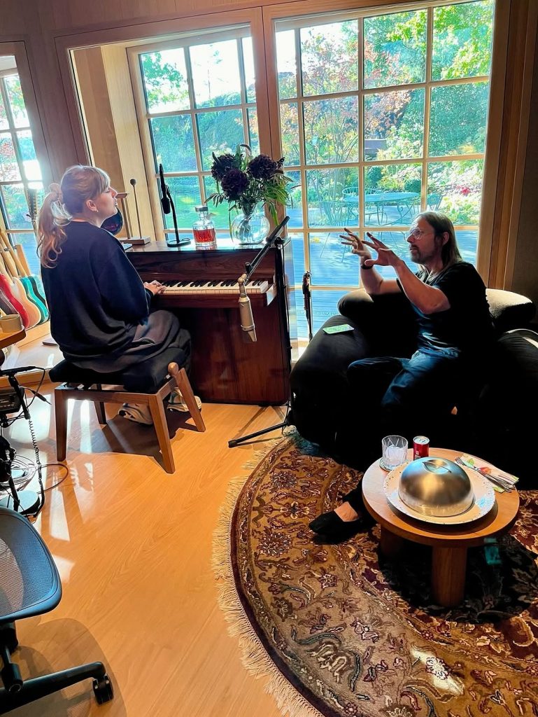 Taylor Swift at the keys, deep in conversation with a team member during the songwriting and creative process. Picture: Instagram@TaylorSwift