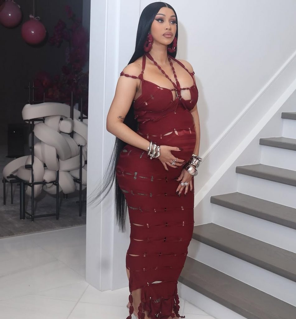 Cardi B serving elegance and mama glow as she lovingly holds her baby bump. Picture: Instagram@CardiB