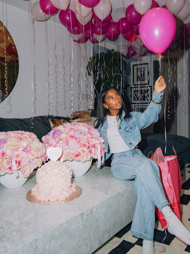Birthday girl Sami is now 11, surrounded by colourful flowers and holding a pink balloon. Picture: Instagram@WinnieHarlow
