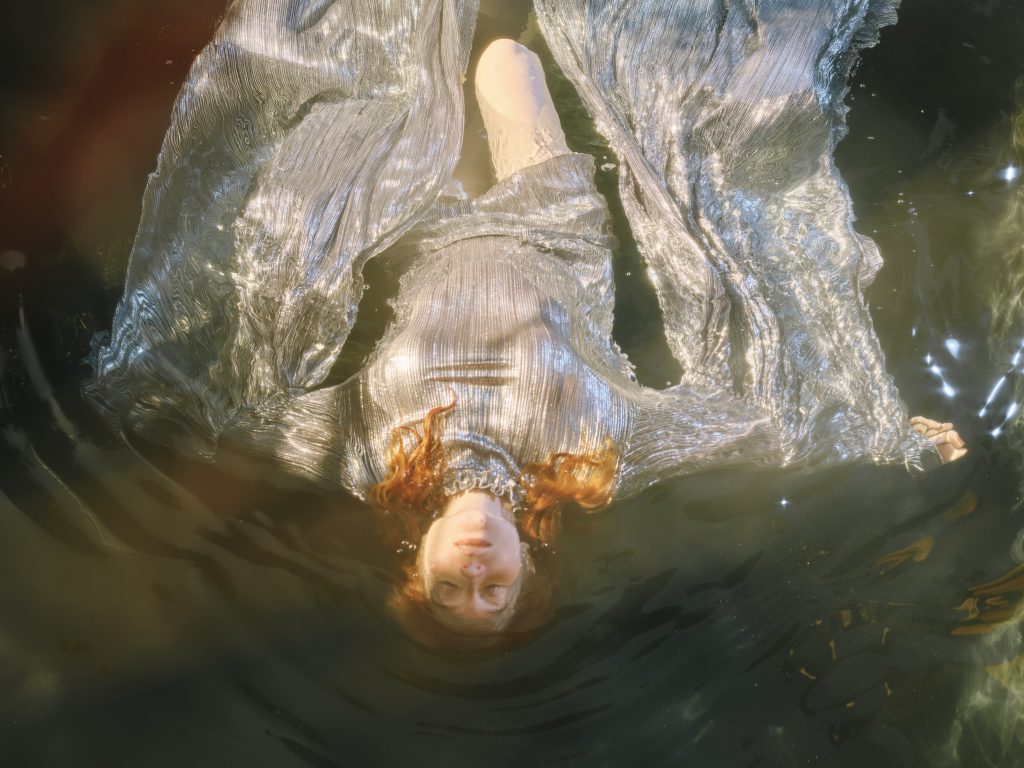Lu_Ah floats in stillness, eyes closed, in deep connection with her soul. Picture: Supplied