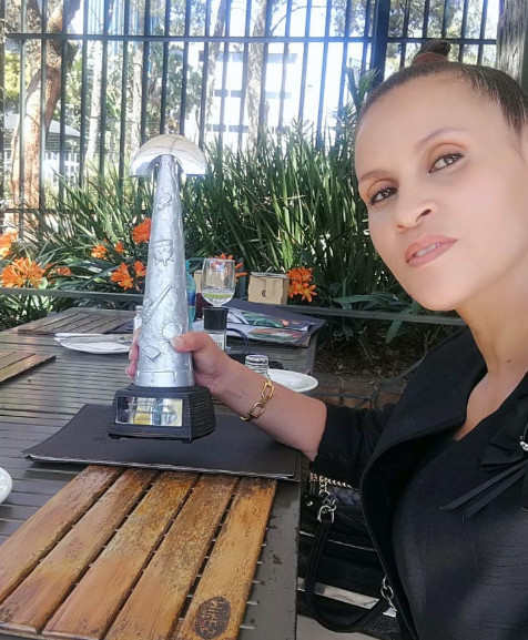 Sylvia Tshanda, wife of the late Dan Tshanda, holding the 2020 SAMA Lifetime Achievement Award given in honour of her late husband. Picture: Instagram@DalomKids