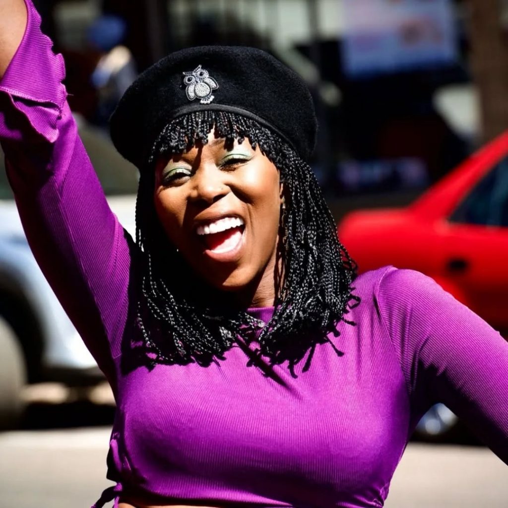 Brenda Ngxoli strikes a pose in a bold purple outfit and black beret, all geared up to continue filming as the late pop icon Brenda Fassie. Picture: Instagram@BrendaNgxoli