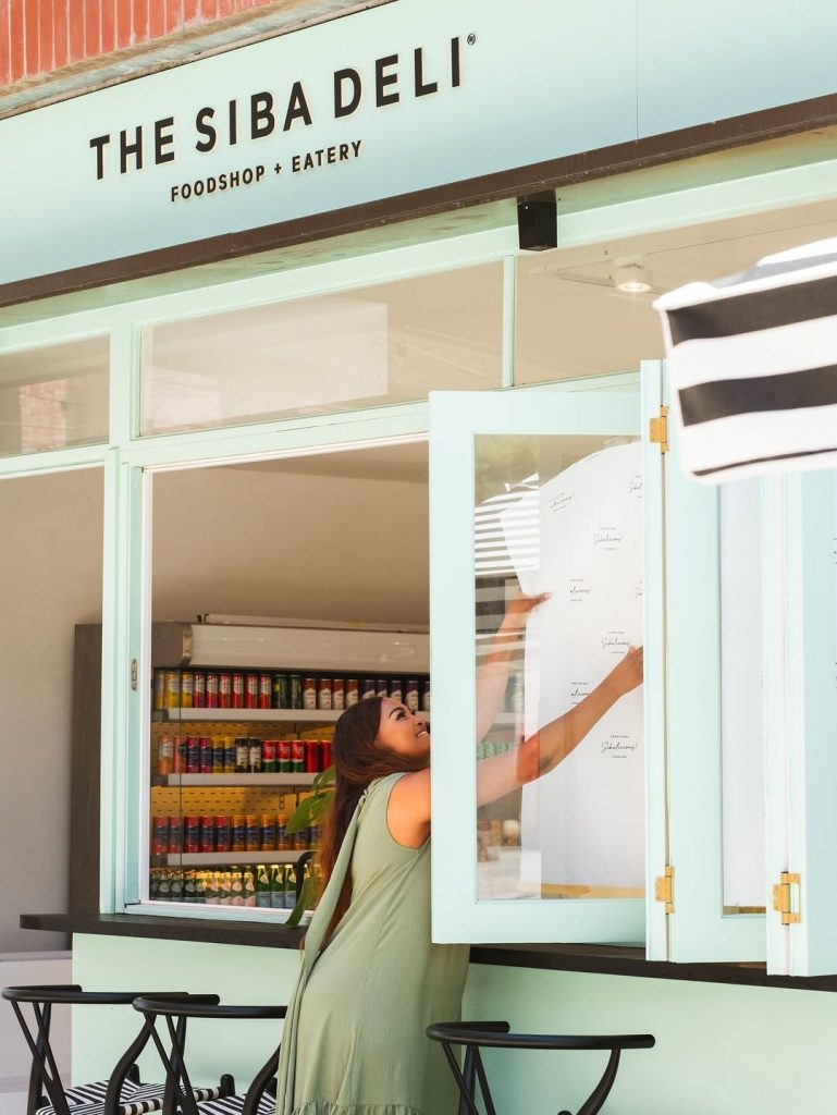 Siba smiles with joy during the launch of her new eatery. Picture: Instagram@SibaMtongana