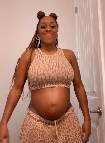 Naomi proudly flaunts her baby bump as she eagerly awaits motherhood. Picture: Instagram@TrinityFatu