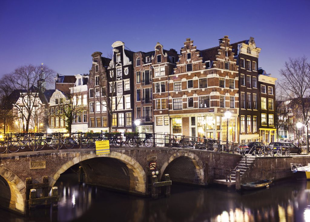 Amsterdam’s nighttime charm, glowing beautifully under its city lights. Picture: Supplied