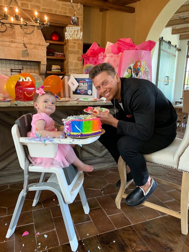 A snapshot of The Miz and Monroe enjoying her birthday treat as a little girl. Picture: Instagram@Mikethemiz
