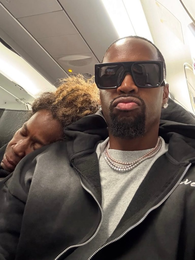 Safaree with Shirley asleep on his shoulder during their flight. Picture: Instagram@Safaree
