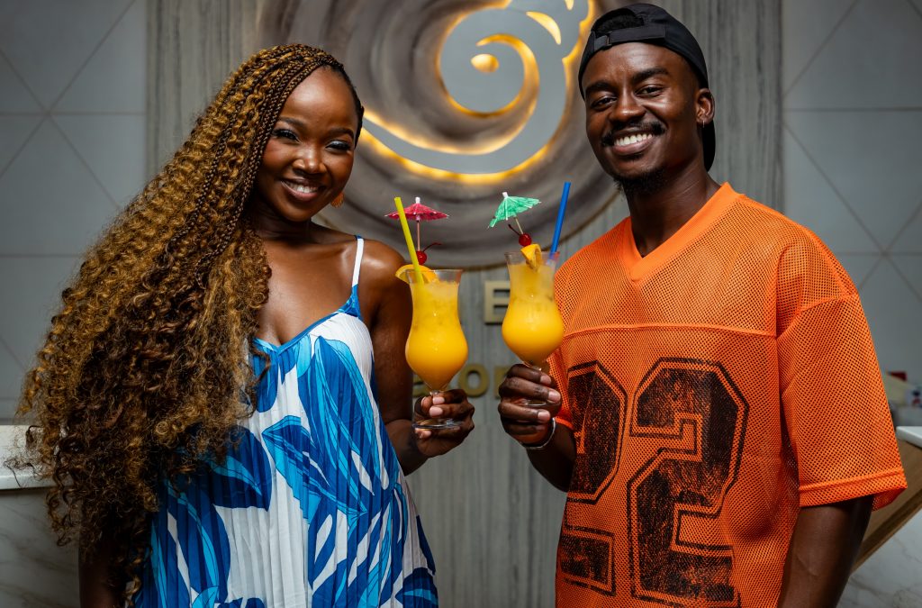 Zanele and Hungani raise a glass of Tropika in style. Picture: Supplied