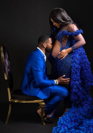 The couple coordinated in blue as Montez Ford gently kissed Bianca Belair’s baby bump during a photoshoot. Picture: Instagram@BiancaBelair