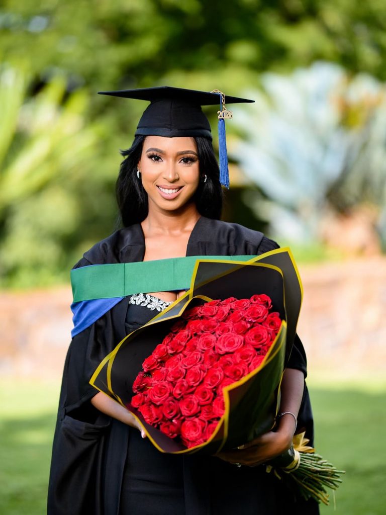The woman of the hour, Theo’s wife Vourne Kgosinkwe, beamed with joy as she posed in her graduation gown, holding a bouquet of roses and flashed a big, proud smile. Picture: Instagram@TheoKgosinkwe