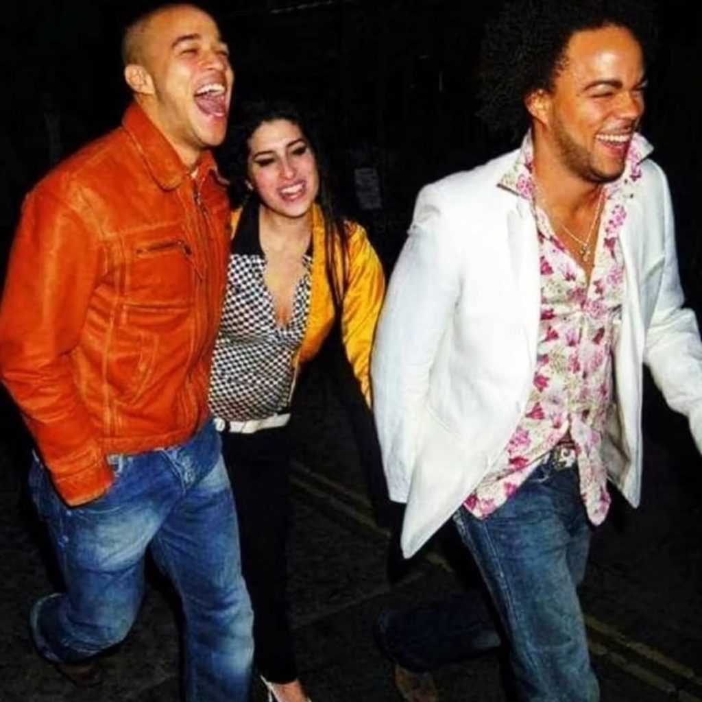 A cheerful photo of Amy Winehouse, Nate James, and a friend, all smiling together. Picture: Instagram@Thenatejames