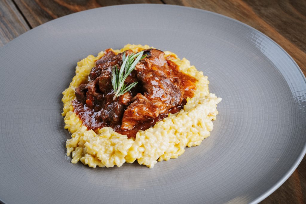Slow-cooked ossobuco served alongside creamy risotto. Picture: Supplied