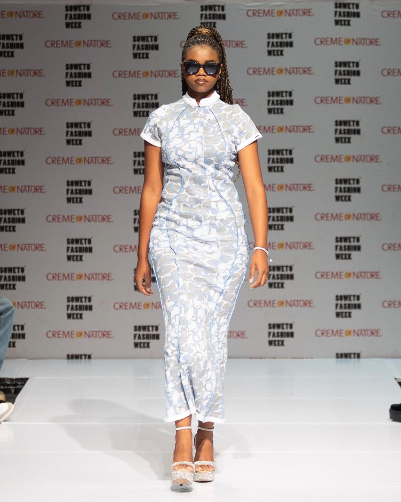 Soweto Fashion Week AW26. Model showcases IDAYIMANI's Blue Maxi Dress, paired with IDAYIMANI's Navy Blue Millionaire Logo Sunglasses. Picture: Supplied