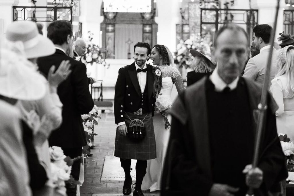 The couple captured walking out of the church after their wedding ceremony as the crowd cheered them on. Picture: Instagram@OfficialMelB