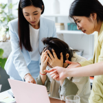 An employee experiencing a stressful moment at work