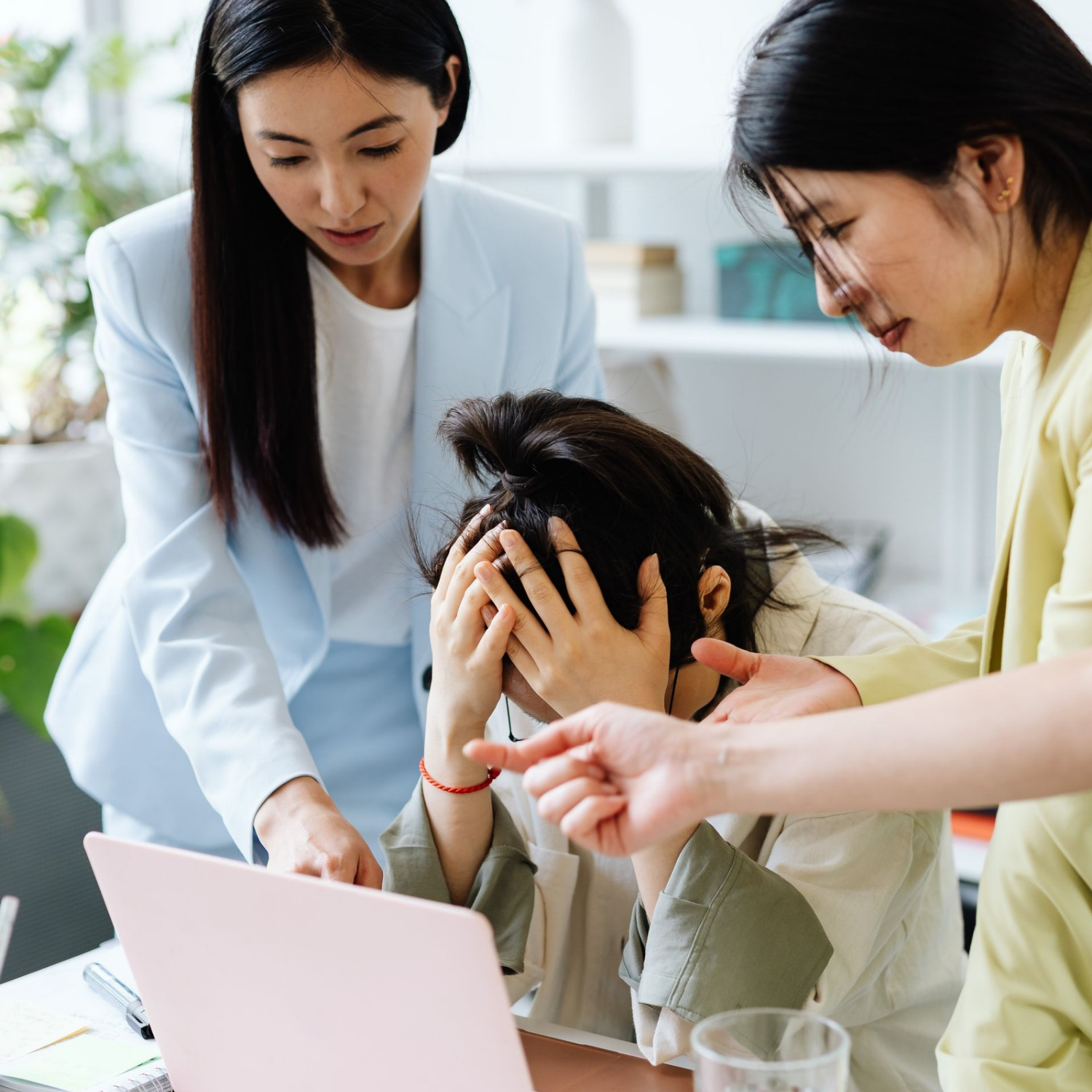 An employee experiencing a stressful moment at work